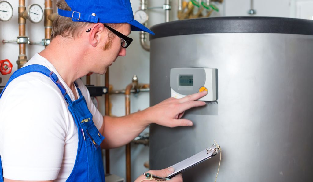 Plumber Fixing Hot Water Tank in Yukon, OK