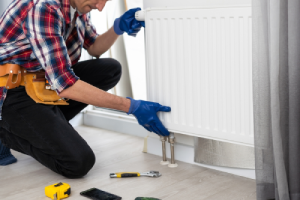 plumber repairing a leaking pipe in Oklahoma City