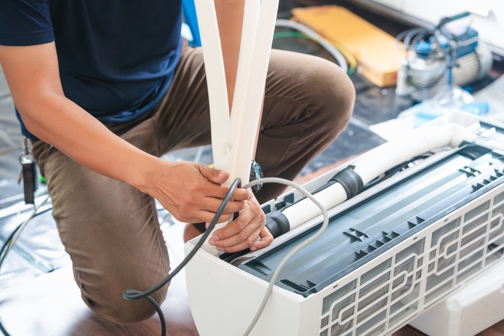 plumber repairing a leaking pipe in Oklahoma City