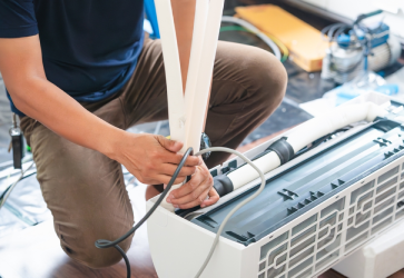 plumber repairing a leaking pipe in Oklahoma City