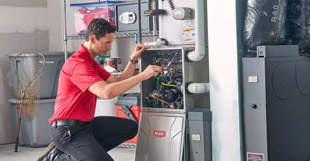 Amped Home Services HVAC technician installing energy efficient HVAC unit.