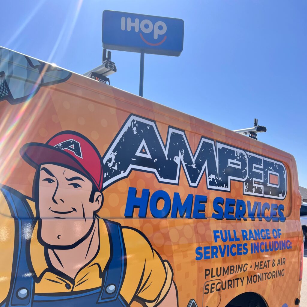 Amped Home Services van providing plumbing, HVAC, and security services in Oklahoma.