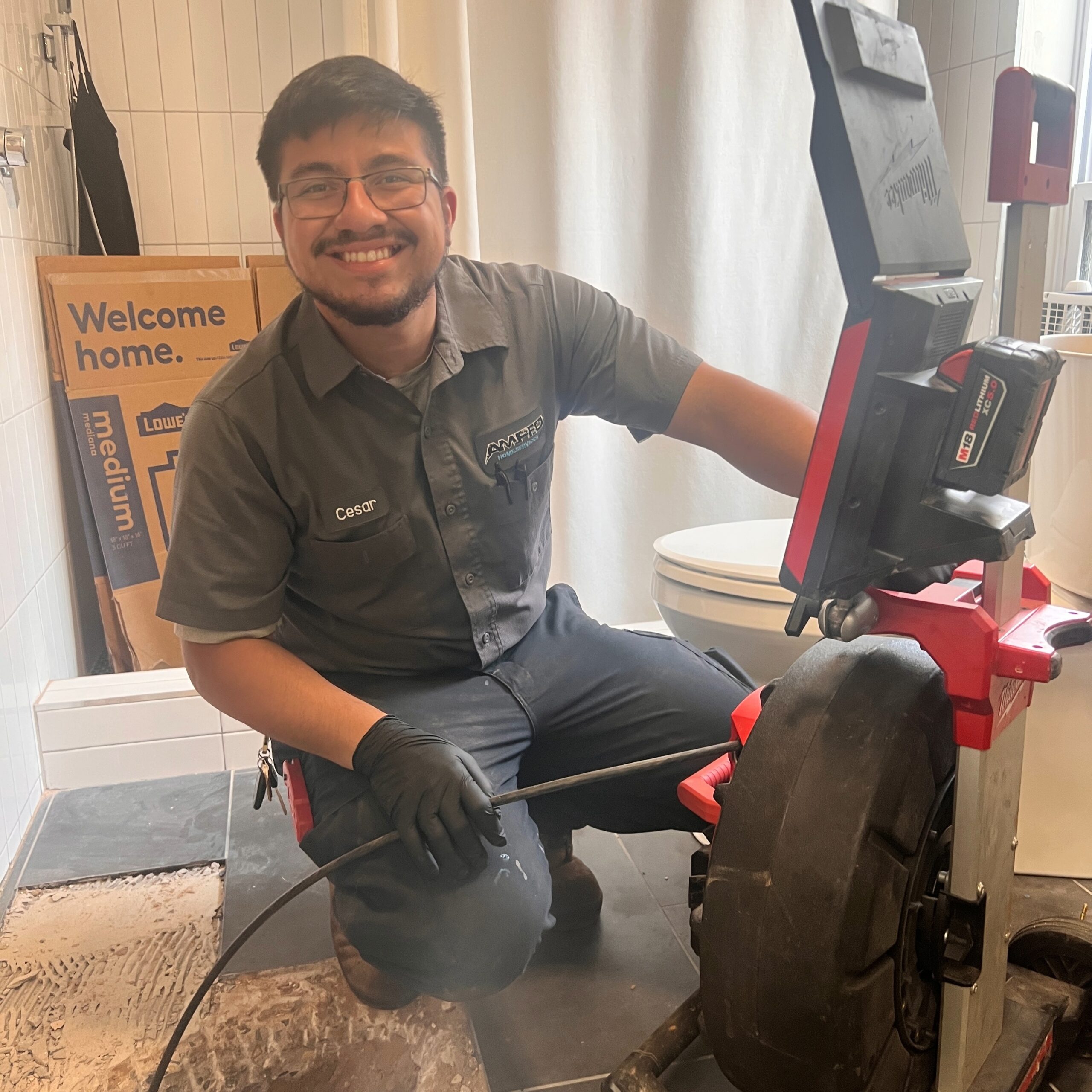 Amped plumber using a sewer camera system to inspect drain lines in Oklahoma.