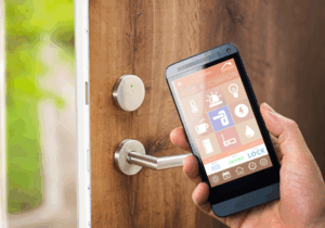 Amped Home Services customer using a smartphone app to see what is new in home security systems