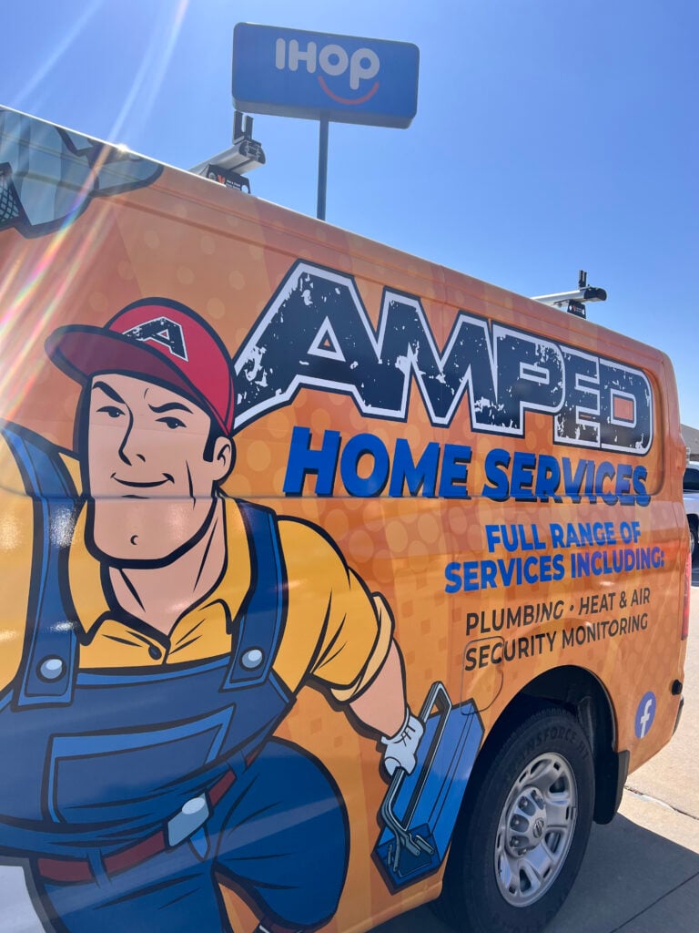 Amped Home Services branded plumbing van in Oklahoma.