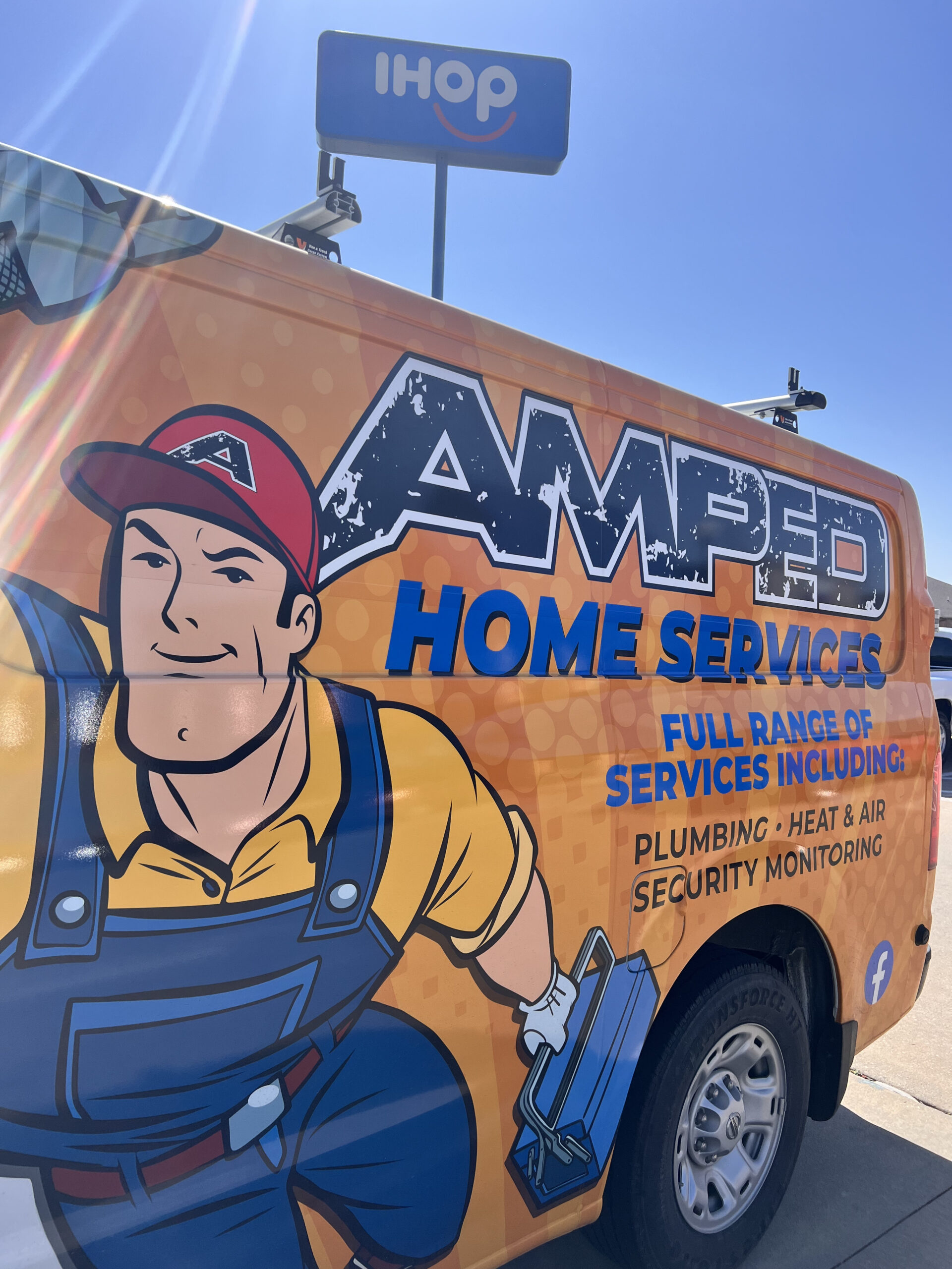 Amped Home Services branded plumbing van in Oklahoma.