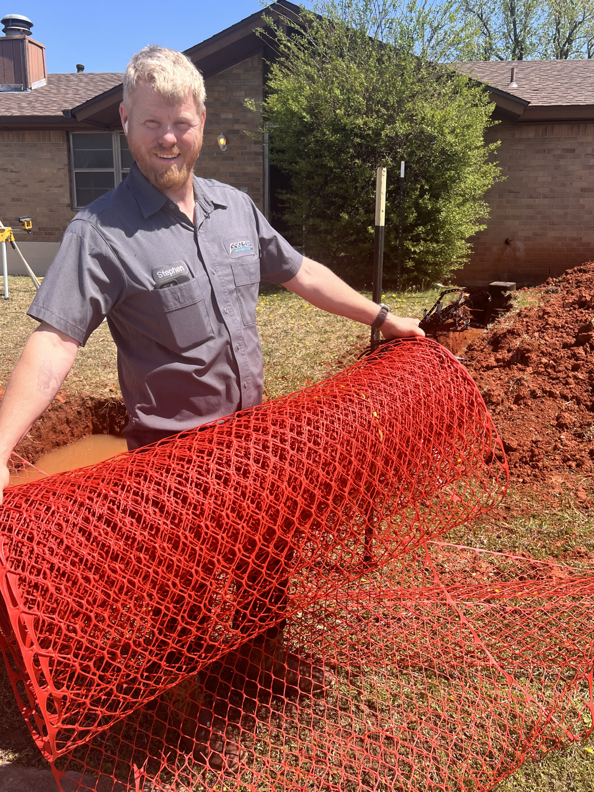 Amped plumber preparing underground utility protection in Oklahoma.