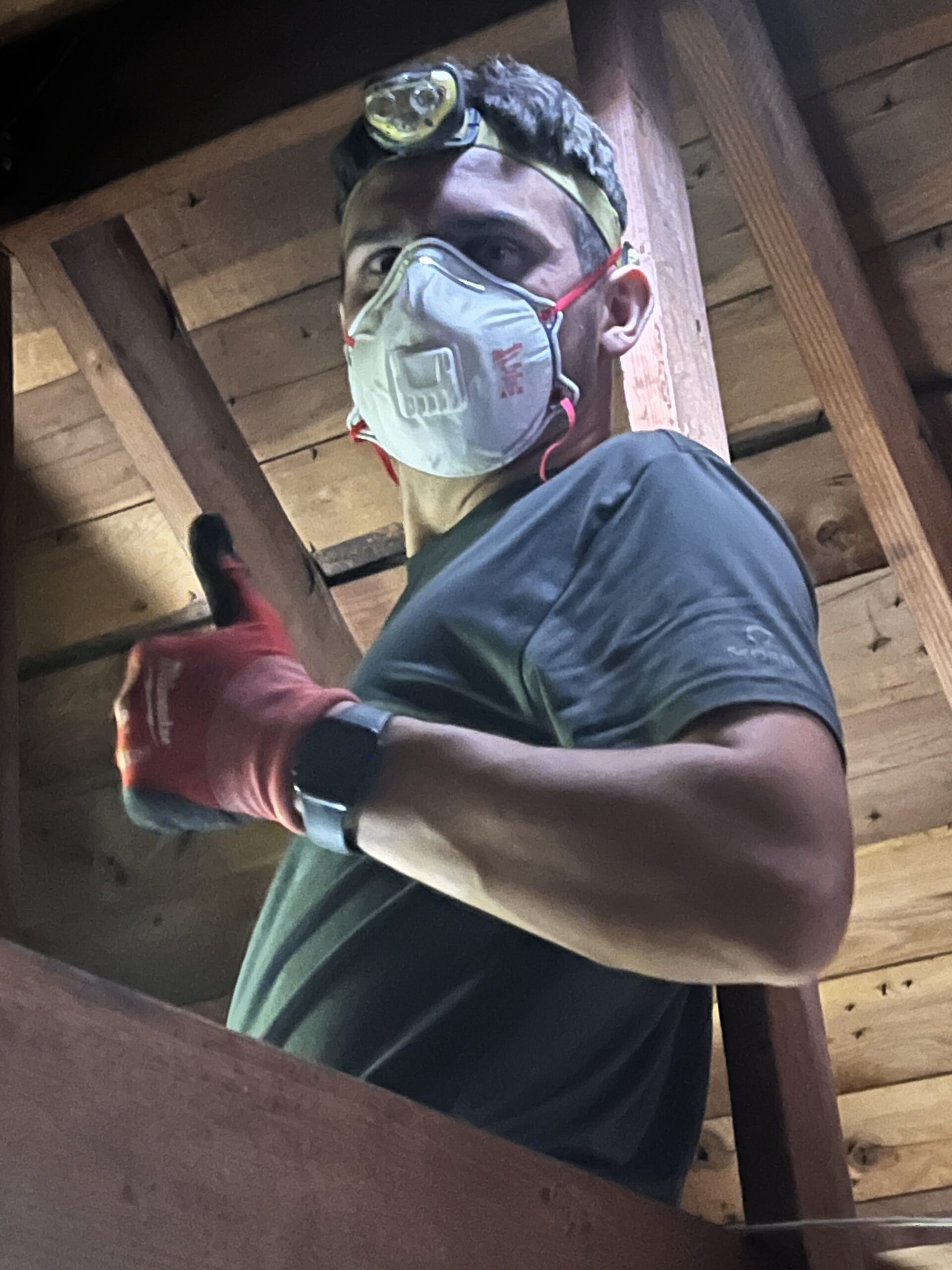 Amped technician working in attic space in Oklahoma.