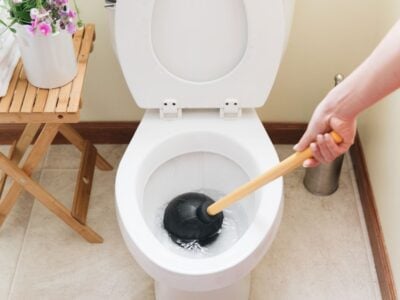 Amped Home Services customer learns how to use a plunger
