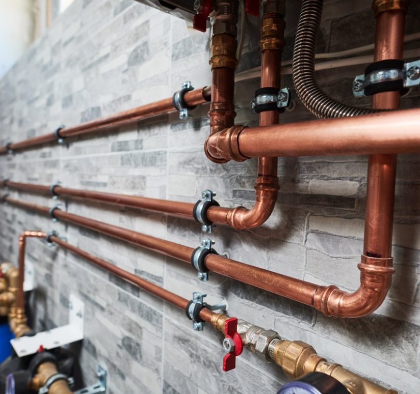 New copper plumbing lines and valves installed for a whole-home repiping system